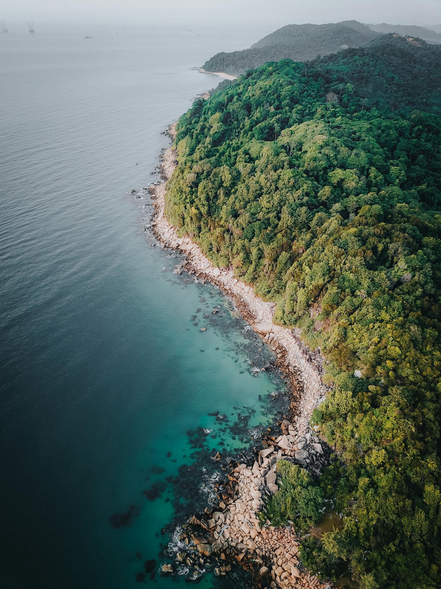 Aerial view of Kijal's lush coastline and clear waters, showcasing nature's beauty.